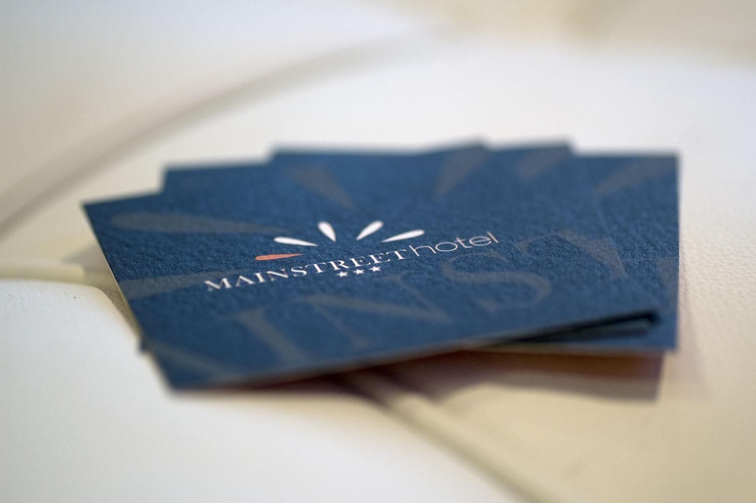 A stack of business cards for MainStreet Hotel.