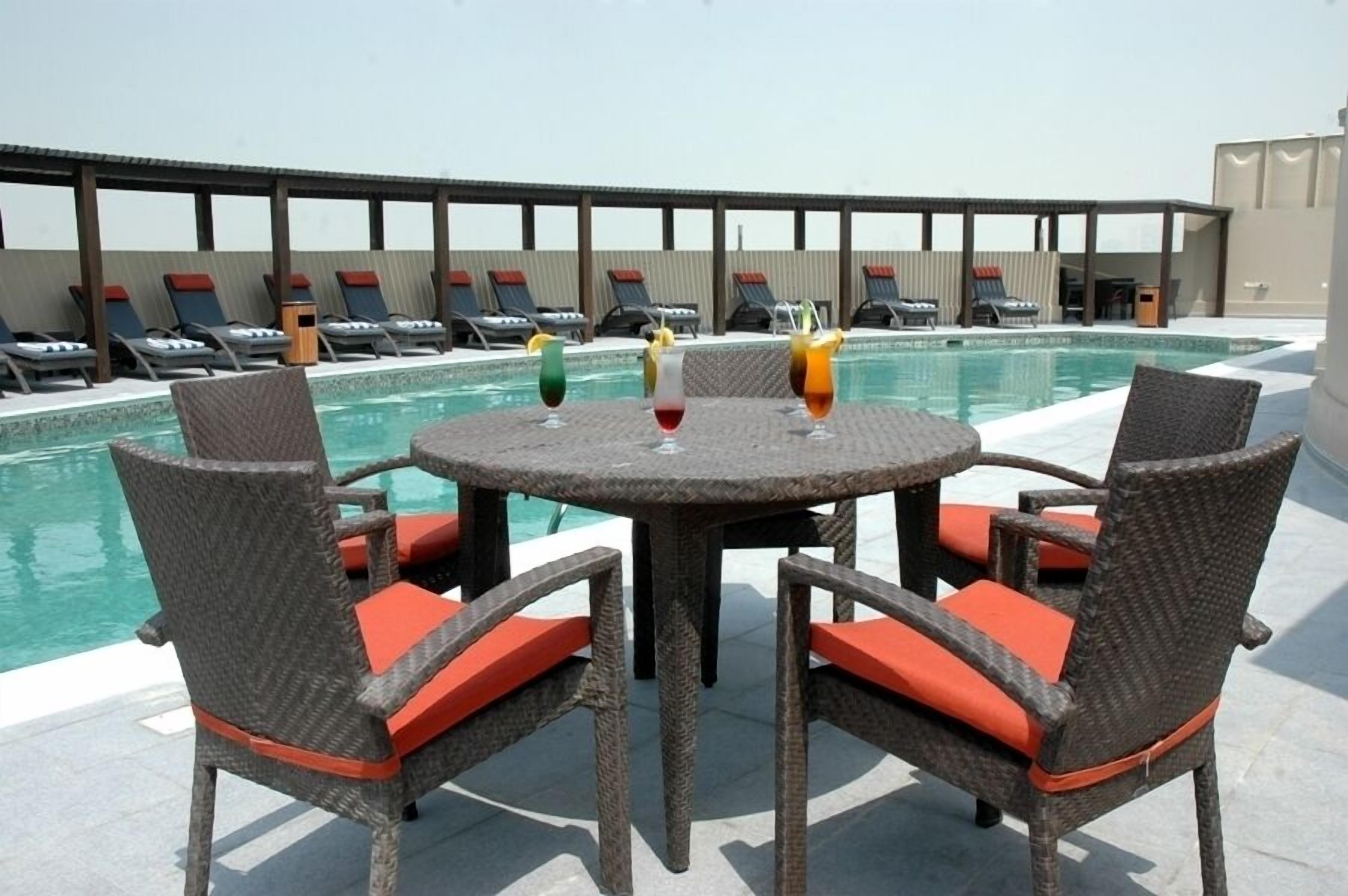 Outdoor pool, pool umbrellas, sun loungers