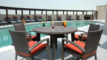 Outdoor pool, pool umbrellas, sun loungers