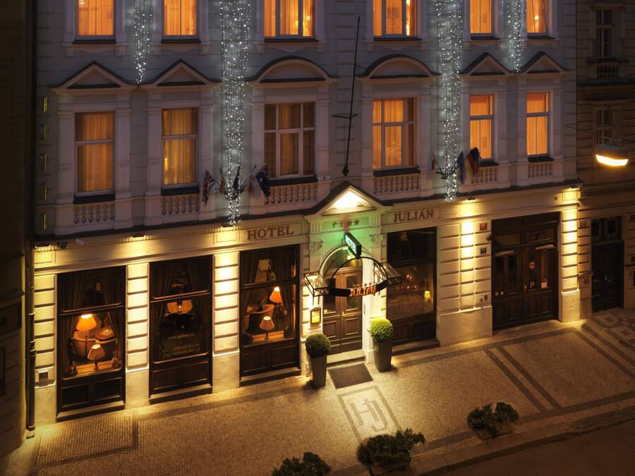 A hotel with a classic facade, a prominent entrance, and a well-lit exterior.