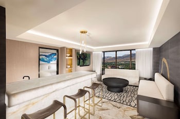 Luxury Suite, 1 King Bed, Non Smoking, Jetted Tub (Separate Living Room) | Premium bedding, in-room safe, desk, laptop workspace at Peppermill Resort Spa Casino