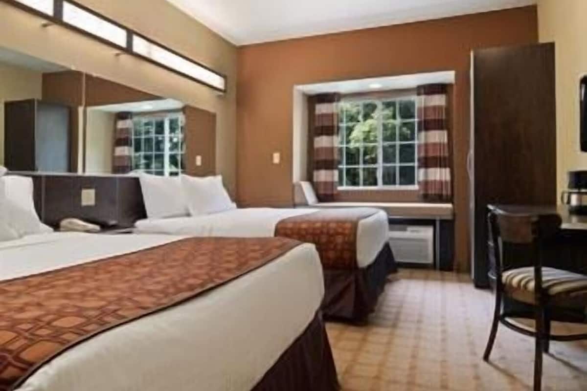 Premium bedding, down comforters, in-room safe, desk