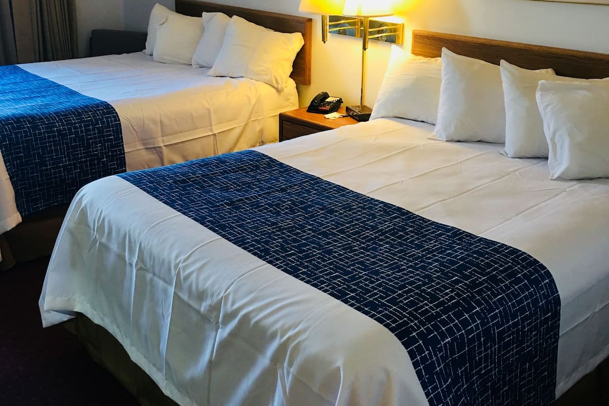 pillow-top beds, desk, blackout curtains, iron/ironing board