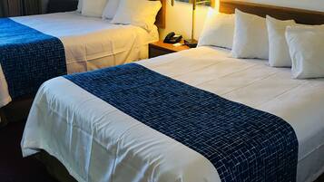 Pillowtop beds, desk, blackout drapes, iron/ironing board