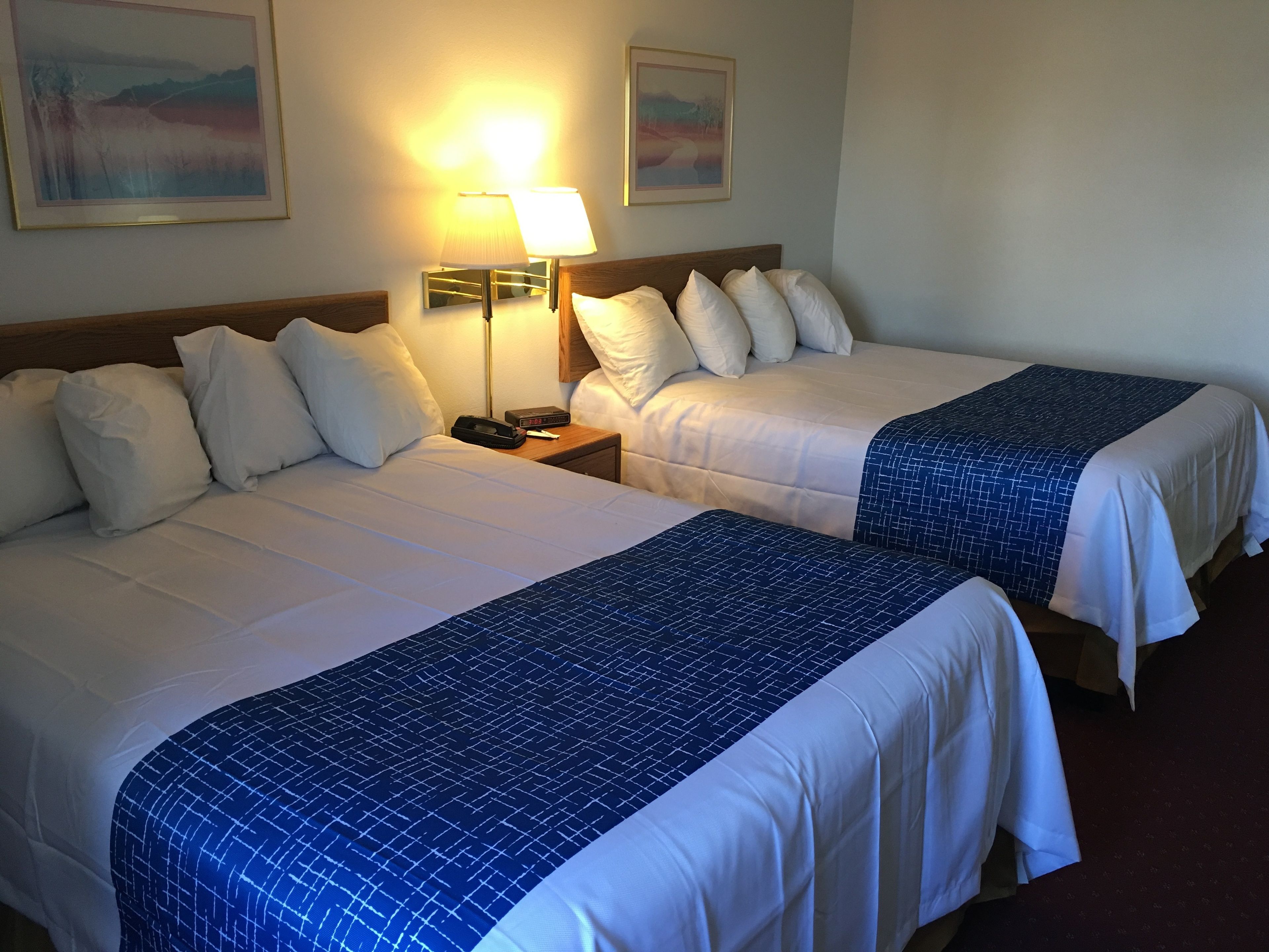 pillow-top beds, desk, blackout curtains, iron/ironing board