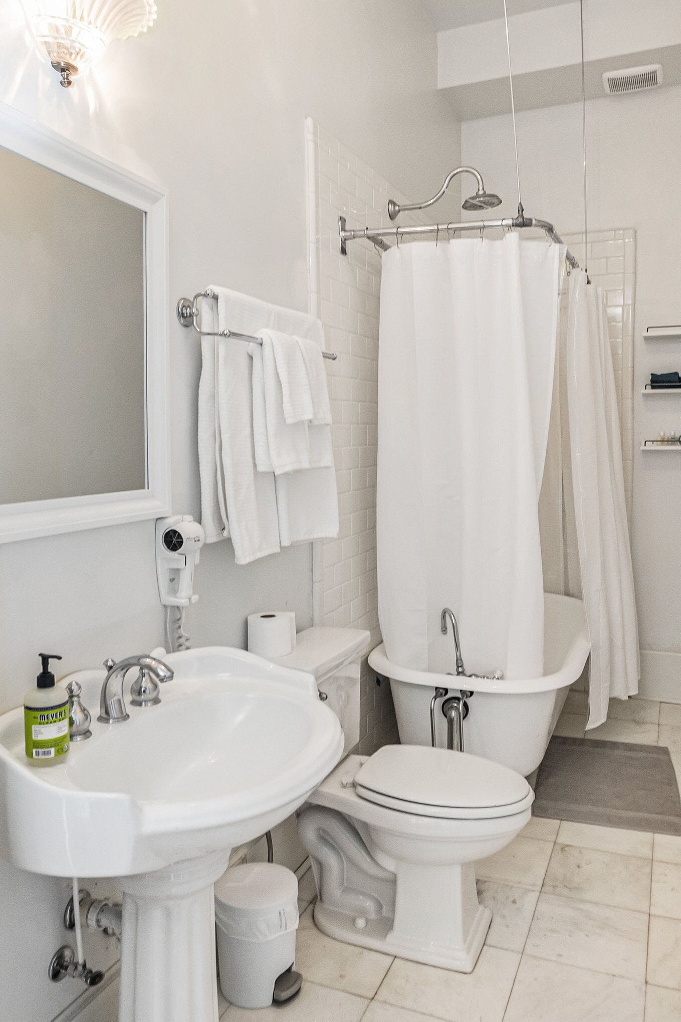 A bathroom with a sink, toilet, and bathtub.