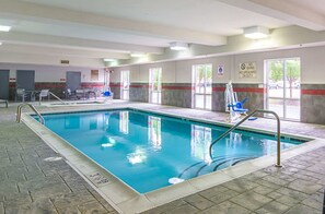 An indoor swimming pool with clear water, a lifeguard stand, and a no diving sign on the wall. - Comfort Suites At Virginia Center Commons (Glen Allen)