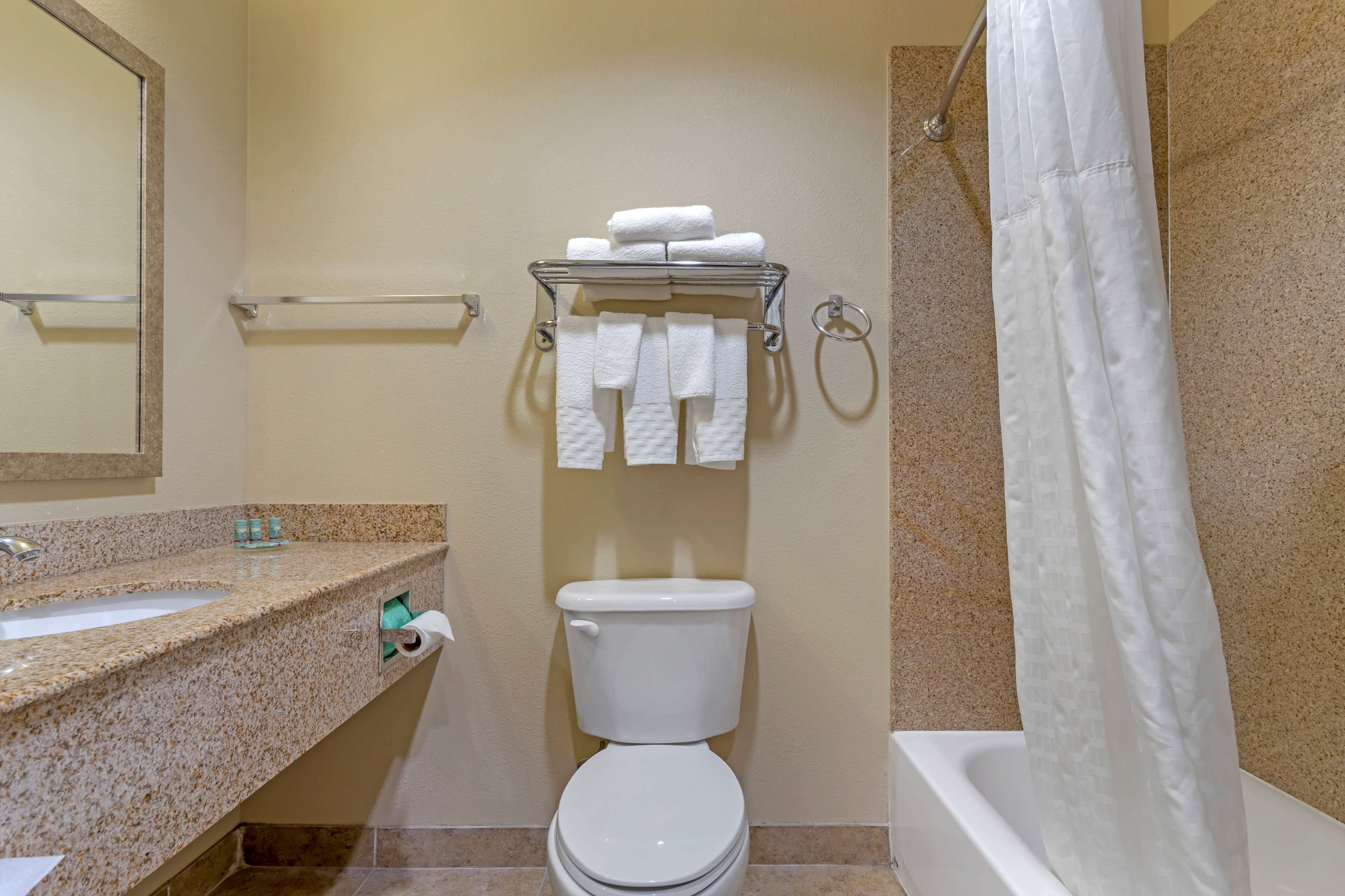 standard room, 2 queen beds, non smoking, refrigerator & microwave | bathroom | combined shower/bathtub, hair dryer, towels