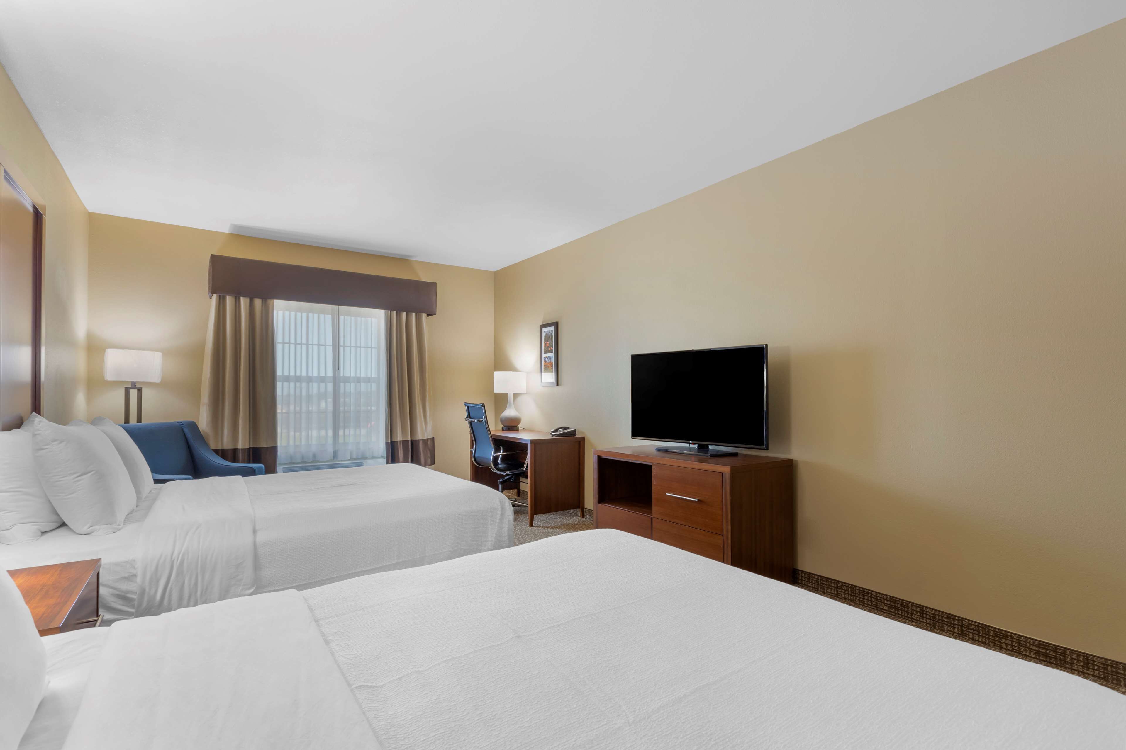 standard room, 2 queen beds, non smoking, refrigerator & microwave | in-room safe, desk, laptop workspace, blackout curtains