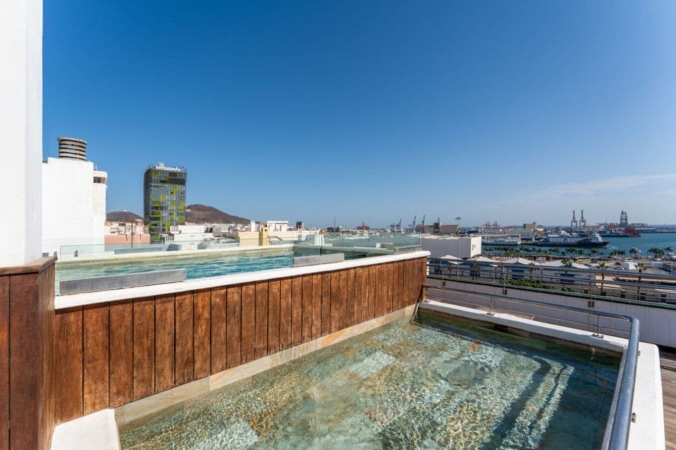 outdoor pool, open 10:00 am to 8:00 pm, pool umbrellas, pool loungers