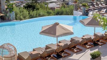 2 outdoor pools, pool umbrellas, sun loungers