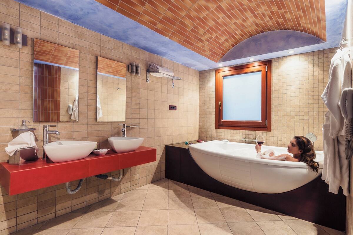 cosmos suite with spa tub | bathroom | designer toiletries, hair dryer, bathrobes, slippers
