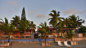 On the beach, sun-loungers, beach umbrellas, beach towels
