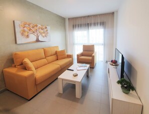 Apartment, 1 Bedroom (4 pax) | Living room | TV - Iberflat Vega De Triana (Camas)