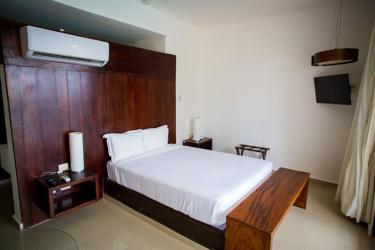 Deluxe Ocean View with Balcony | 1 bedroom, down comforters, blackout drapes, iron/ironing board