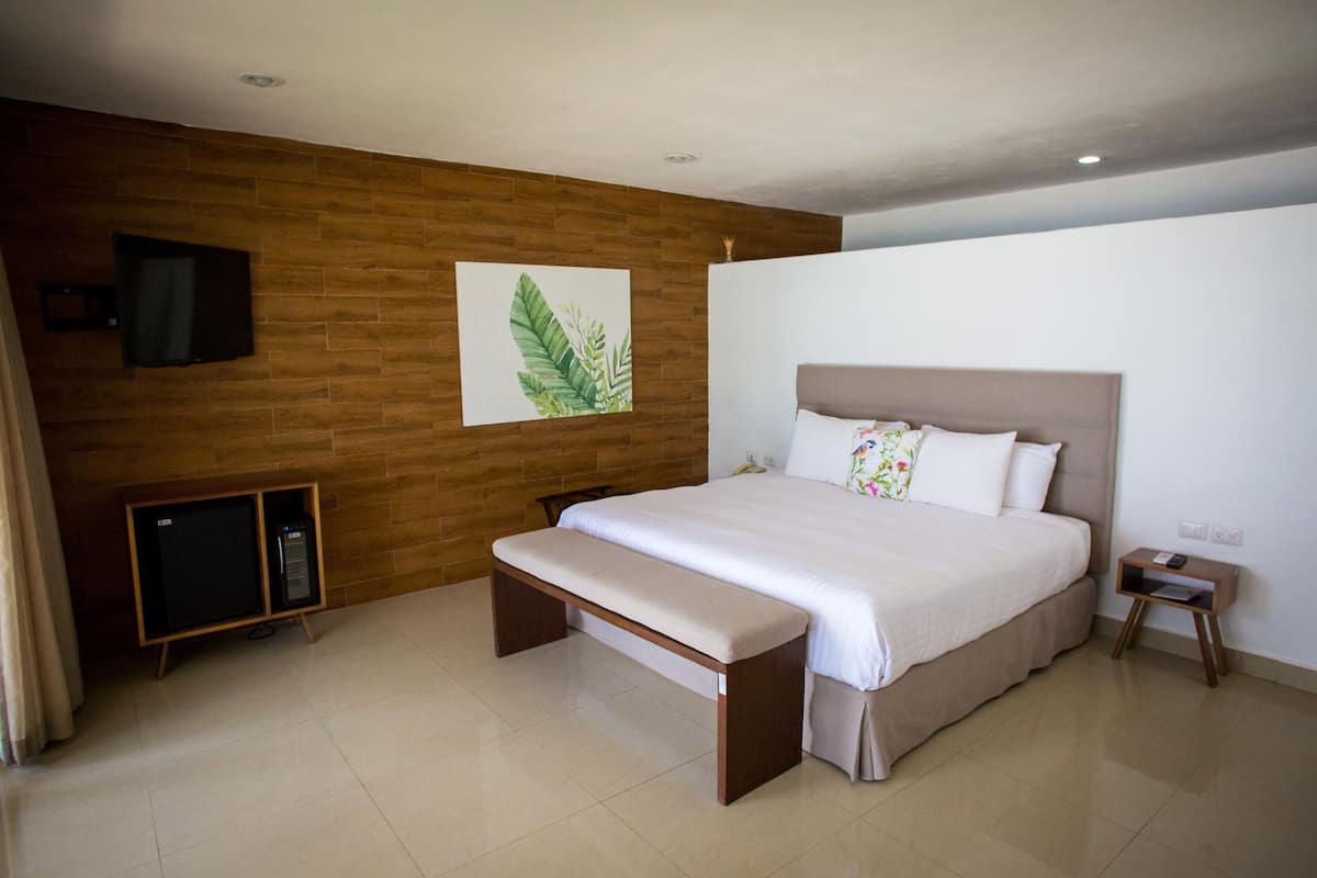 Beach front bungalow with Jacuzzi | 1 bedroom, down comforters, blackout drapes, iron/ironing board