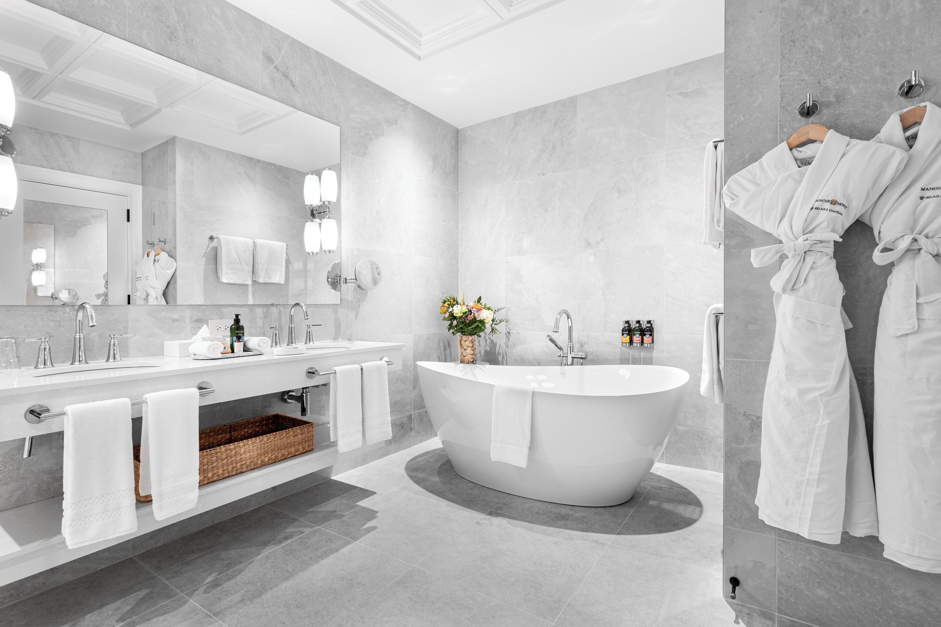 designer toiletries, hair dryer, bathrobes, slippers