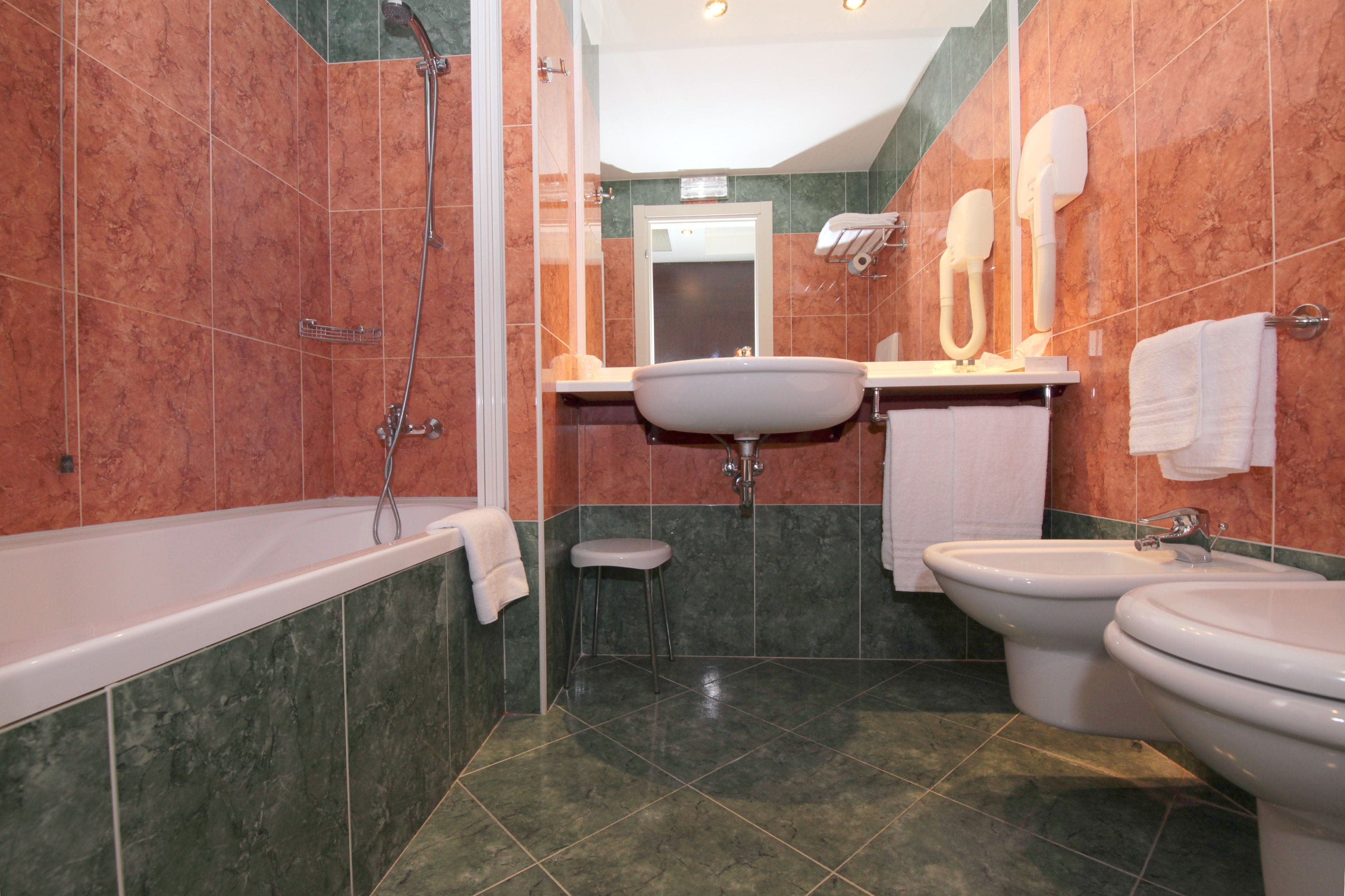 standard double or twin room | bathroom | combined shower/bathtub, hair dryer, towels