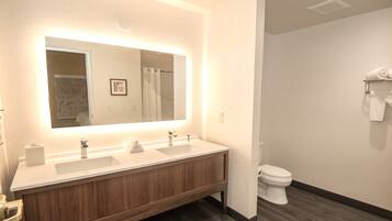 Suite, 1 King Bed | Bathroom | Hair dryer, towels