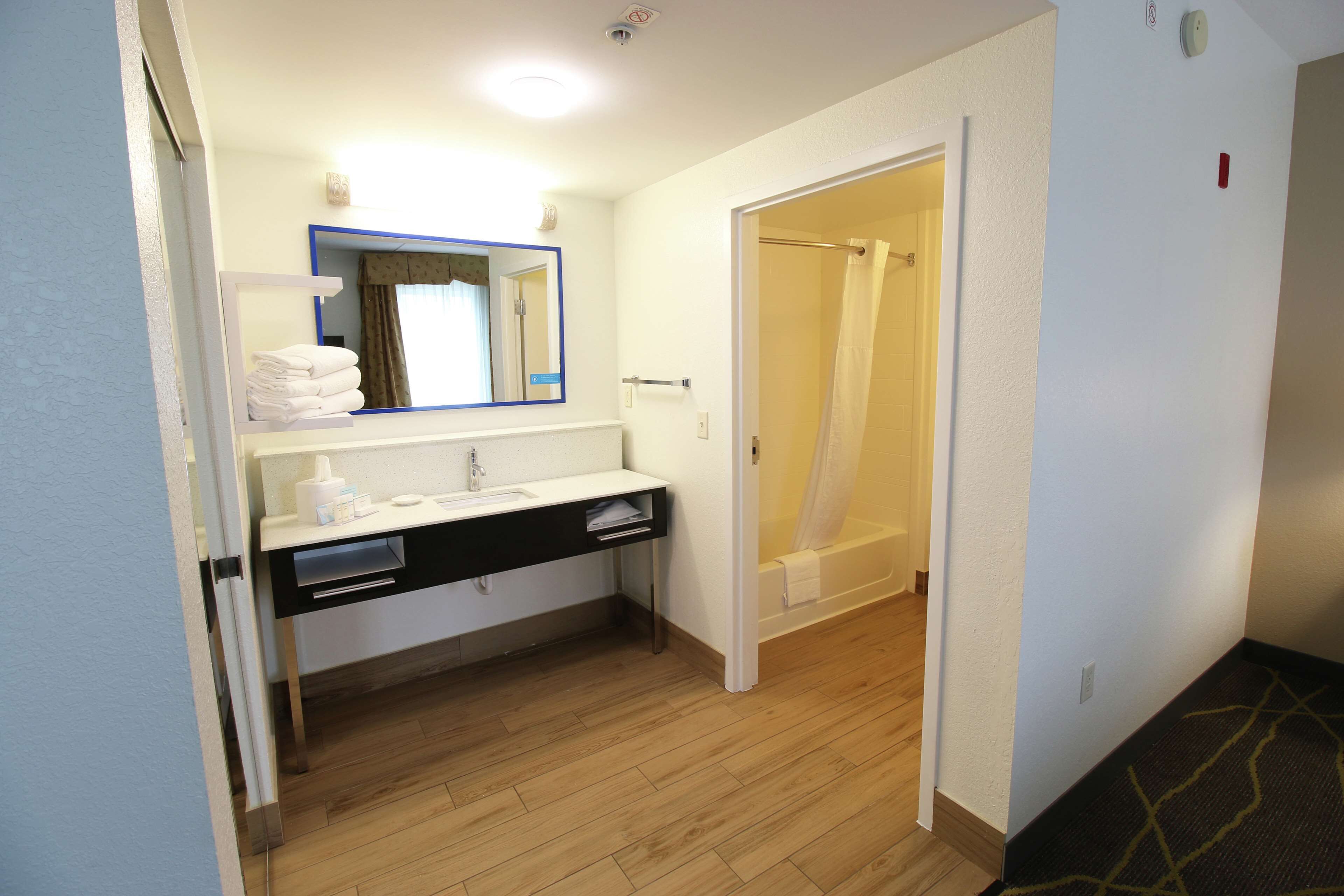 studio suite, 1 king bed with sofa bed | bathroom | shower, free toiletries, towels