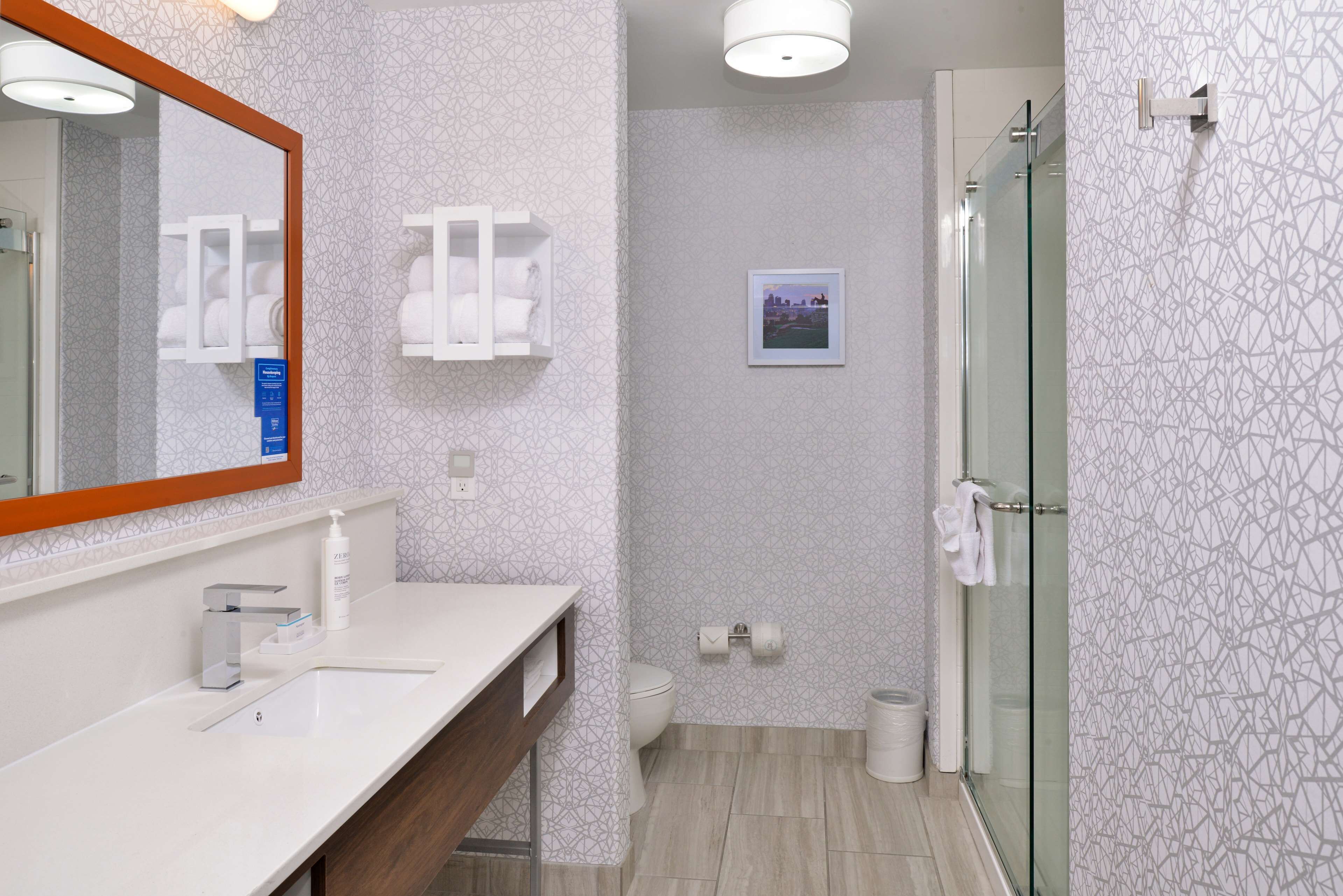 room, 1 king bed, refrigerator & microwave | bathroom | free toiletries, hair dryer, towels