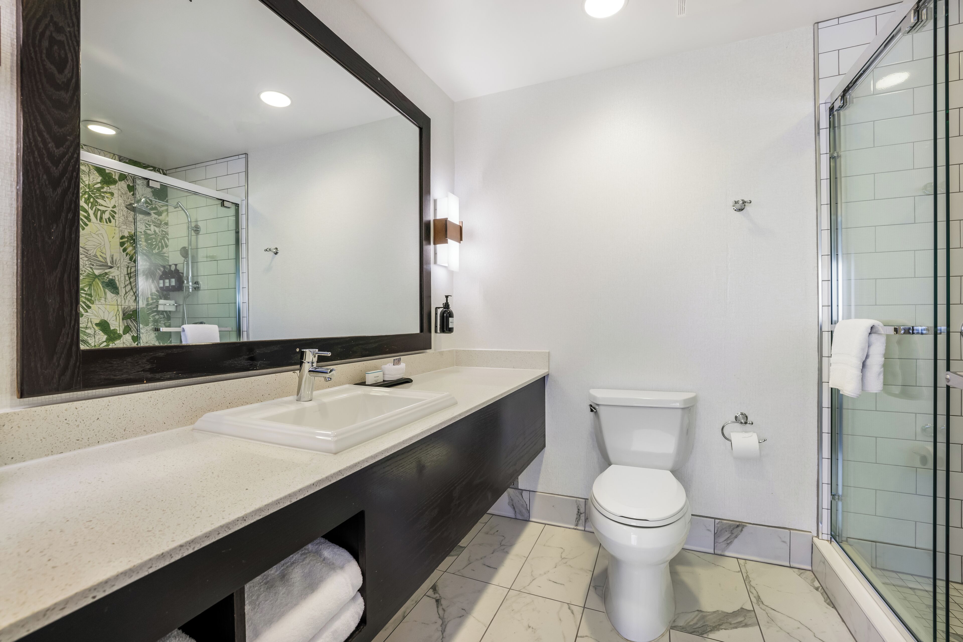 Shower, rainfall showerhead, designer toiletries, hair dryer