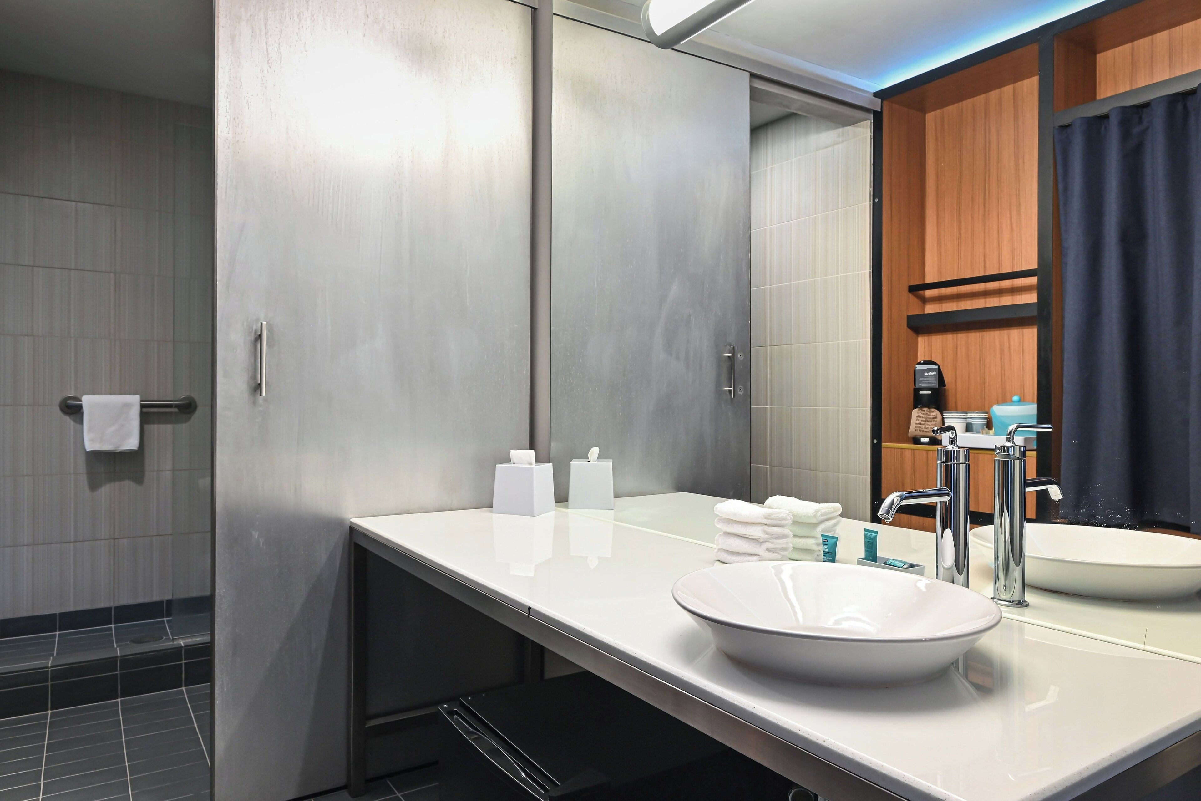 rainfall showerhead, designer toiletries, hair dryer, towels