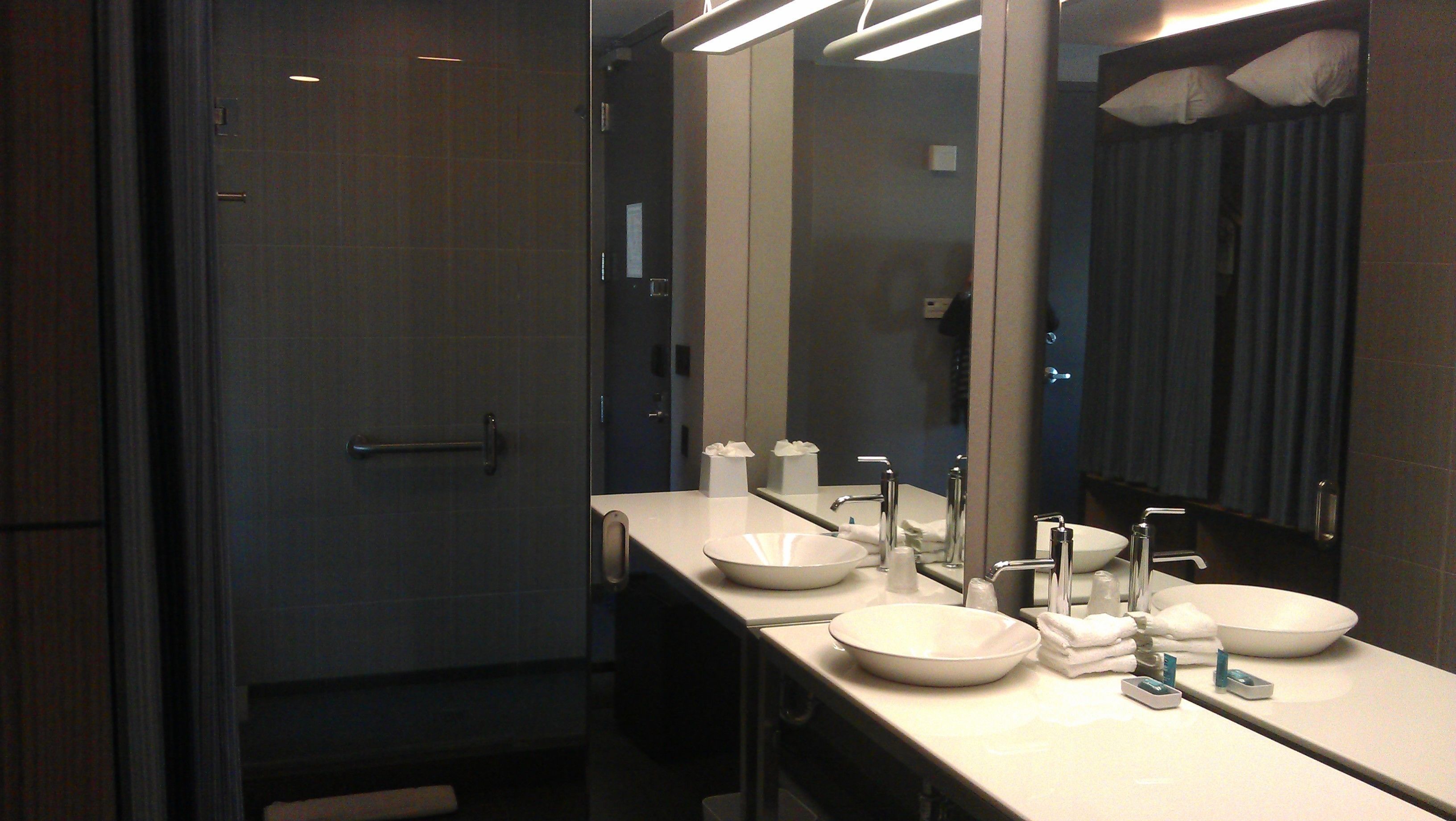 designer toiletries, hair dryer, towels