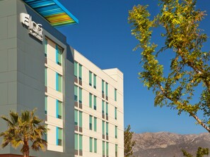 A modern hotel building with a flat facade, multiple windows, and a sign reading "Bloft W Hotels". - Aloft by Marriott Ontario-Rancho Cucamonga (Rancho Cucamonga)