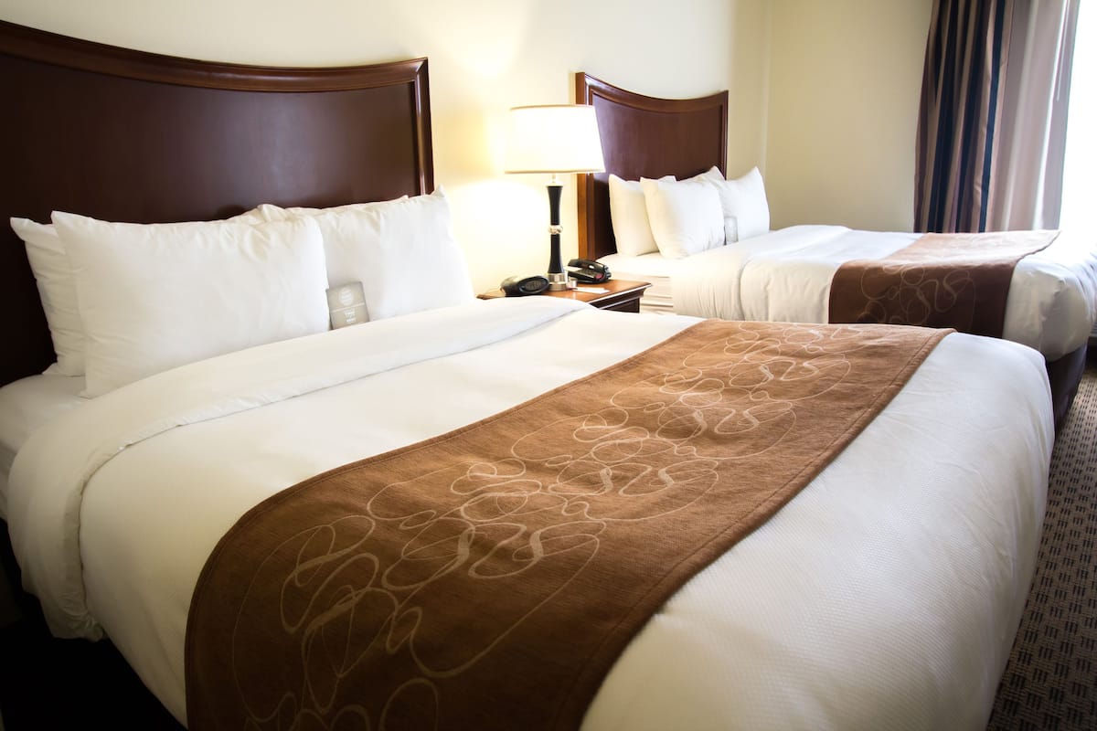 suite, 2 queen beds and sofa-bed, non-smoking | premium bedding, pillow-top beds, desk, laptop workspace