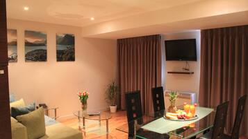 Deluxe Apartment, 2 Bedrooms | Living room | TV