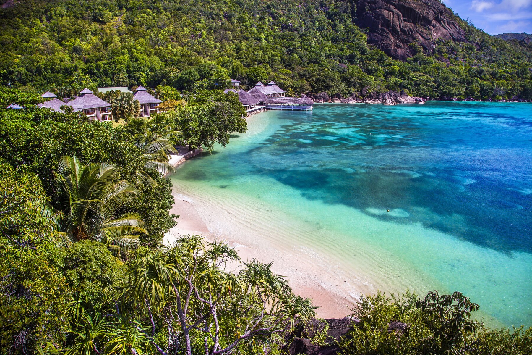 On the beach, white sand, sun-loungers, beach towels