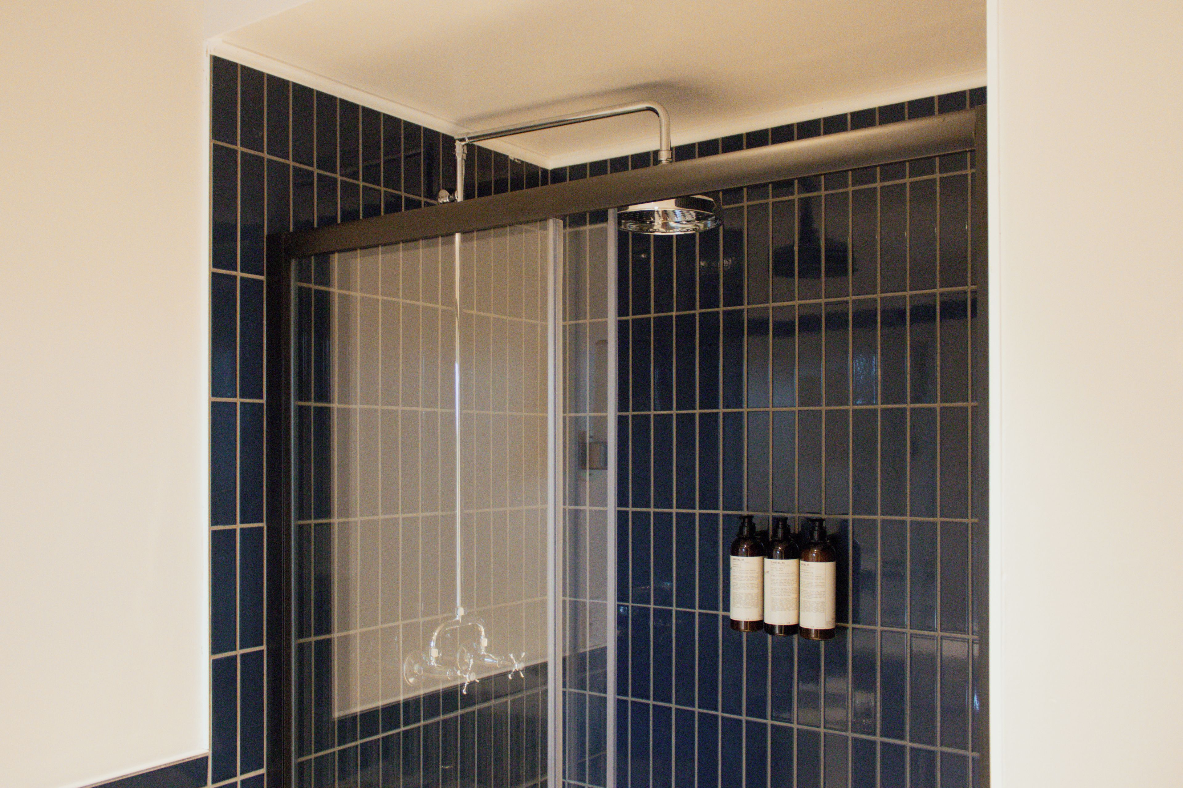 Deluxe Studio Suite, 2 Queen Beds, Private Bathroom | Bathroom | Free toiletries, hair dryer, towels, soap