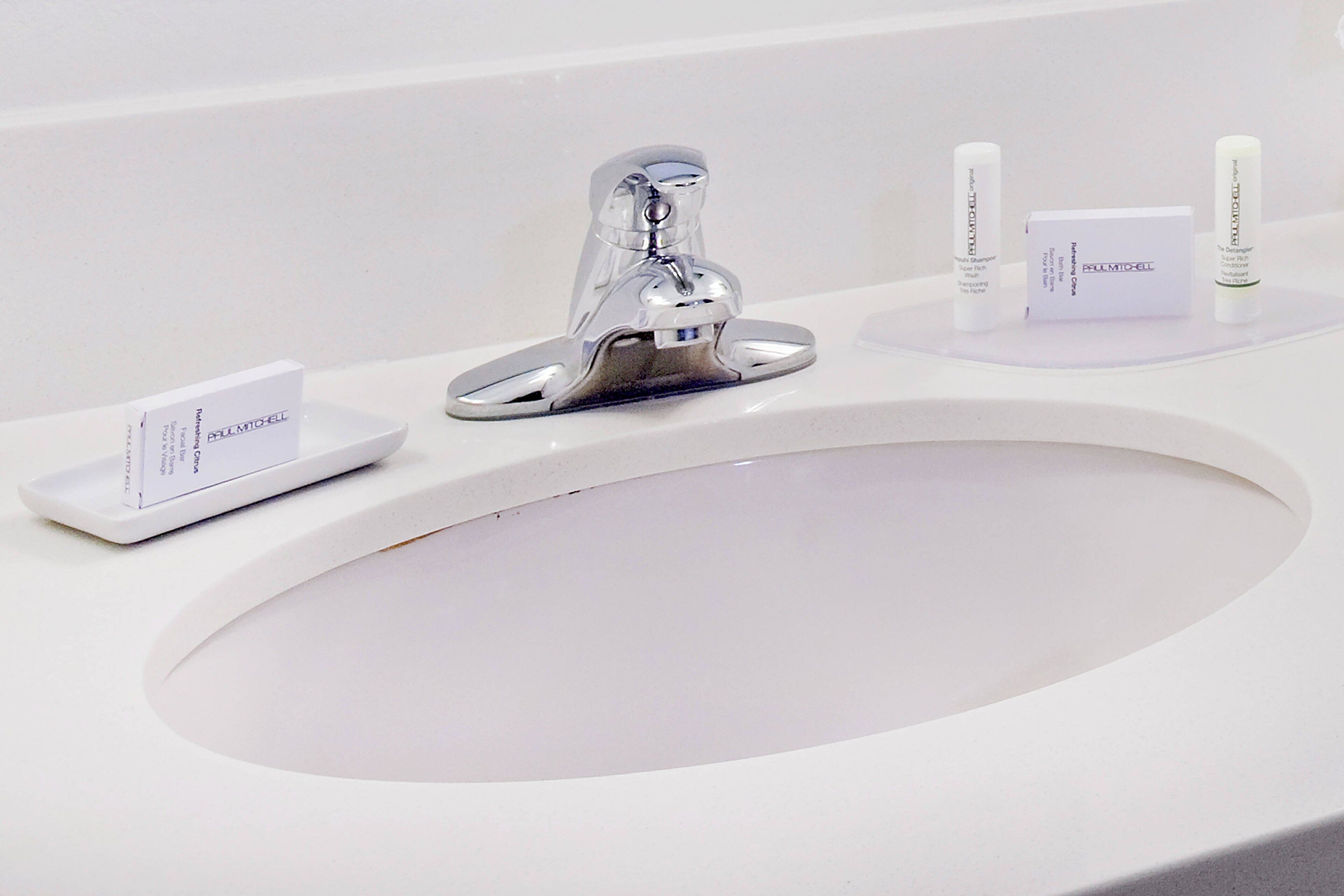 combined shower/bathtub, designer toiletries, hair dryer, towels