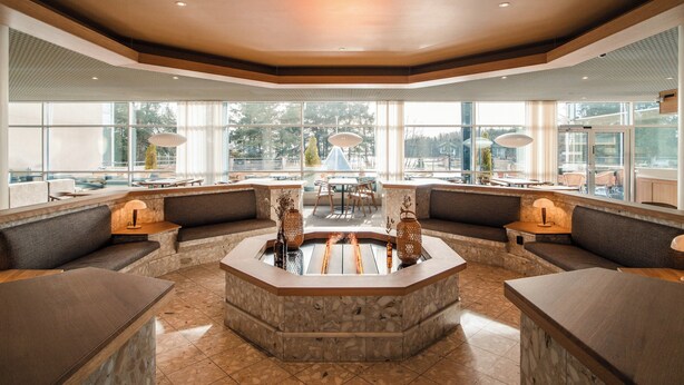 A spacious lobby with a central seating area, large windows, and a modern design. - Ruissalo Spa Hotel (Turku)