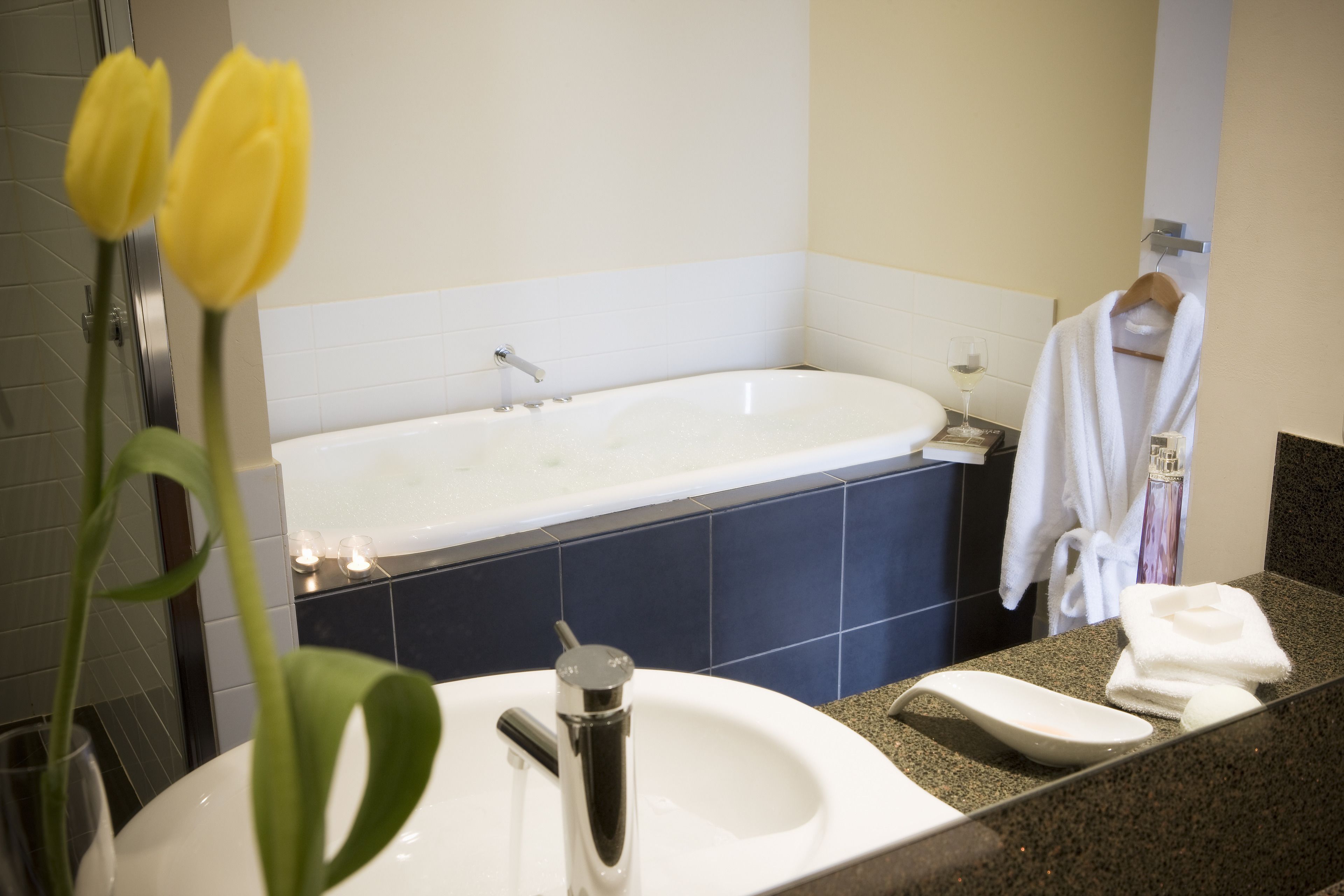 designer toiletries, hair dryer, towels, soap