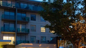A modern building with multiple balconies, large windows, and a glass storefront. - The Sebel Launceston (Launceston)