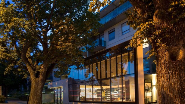 A modern building with large glass windows, surrounded by trees. - The Sebel Launceston (Launceston)