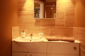 Shower, rainfall showerhead, hair dryer, towels