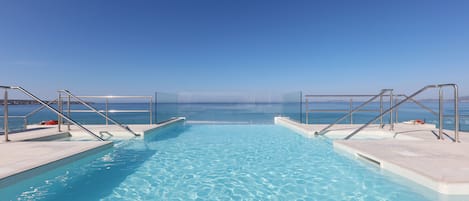 2 outdoor pools, pool umbrellas, pool loungers