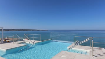2 outdoor pools, pool umbrellas, pool loungers