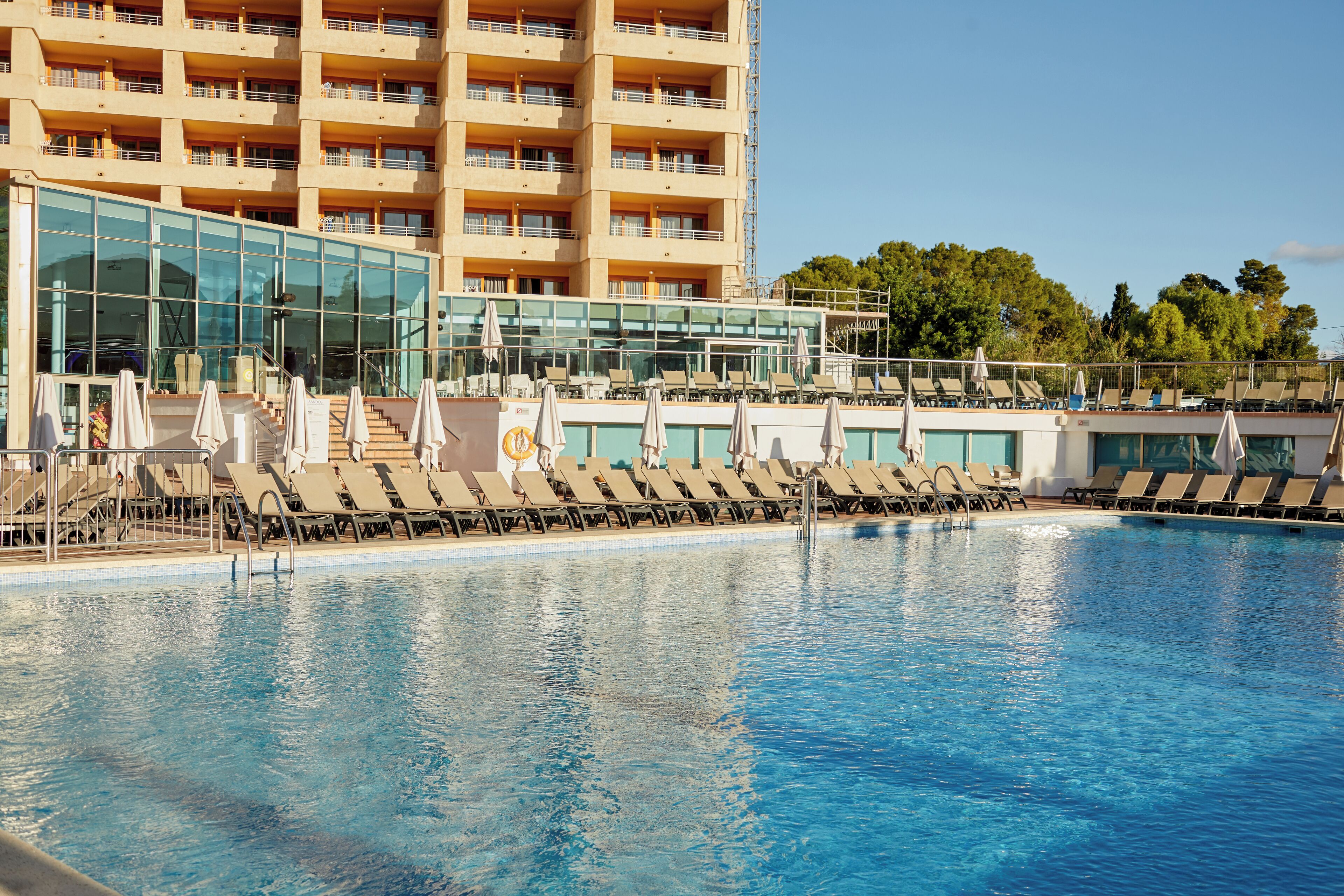 outdoor pool, pool umbrellas, pool loungers