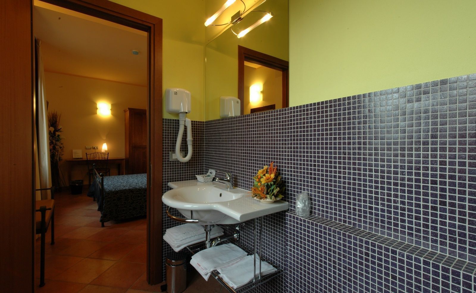 shower, hair dryer, bidet, towels