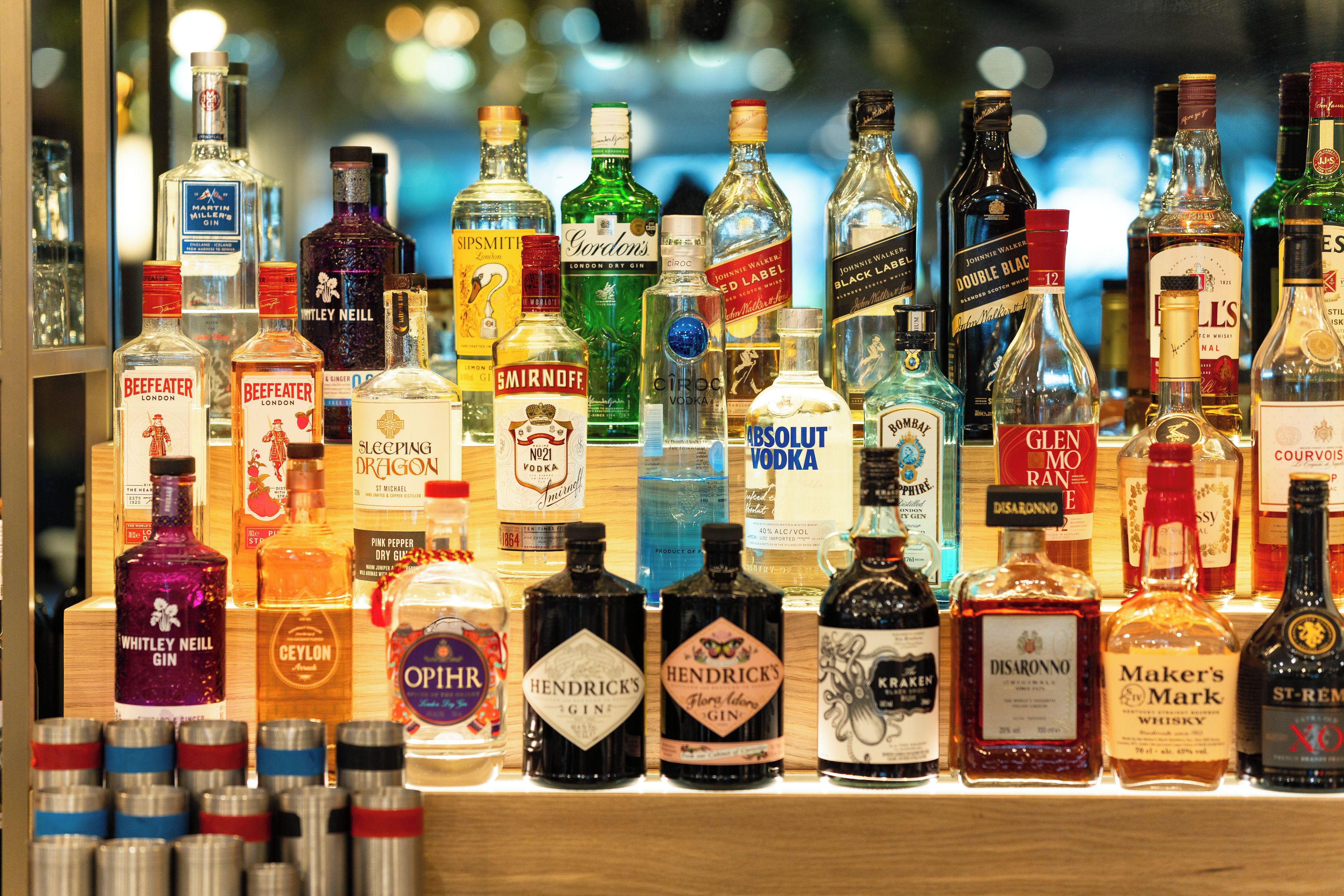 A variety of liquor bottles displayed on shelves.