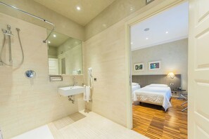 A modern bathroom with a shower, sink, and mirror. - Century Hotel (Parma)