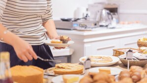 A buffet table with various food items including a cake, pastries, and a pie. - Century Hotel (Parma)