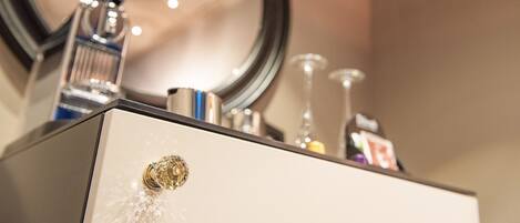 A bathroom vanity with a mirror, a faucet, and a sink.