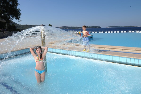 Outdoor pool, free pool cabanas, pool umbrellas