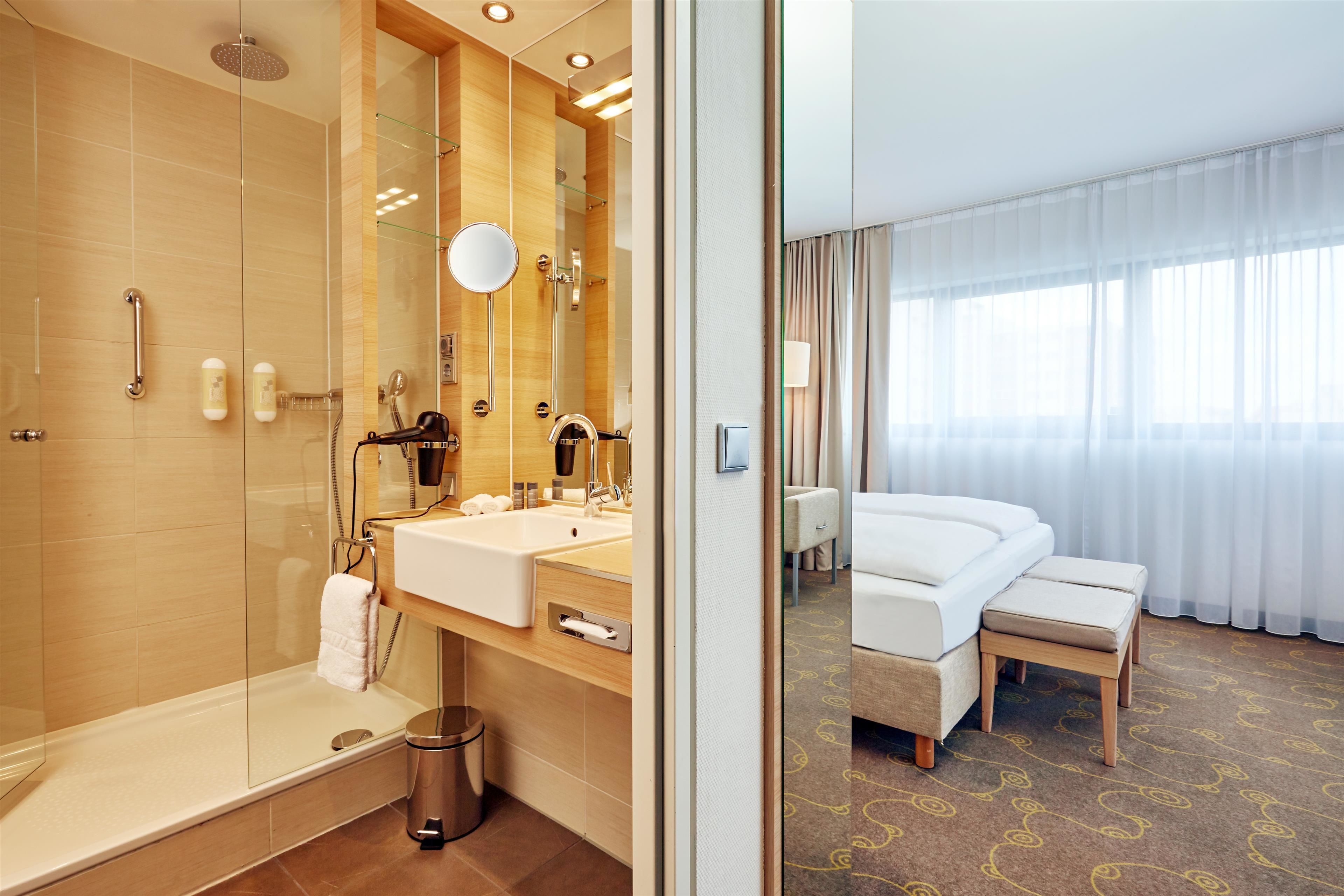 comfort double or twin room | bathroom | shower, rainfall showerhead, hair dryer, slippers