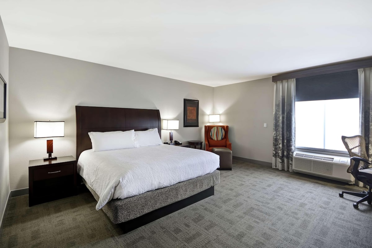 Premium bedding, desk, laptop workspace, iron/ironing board